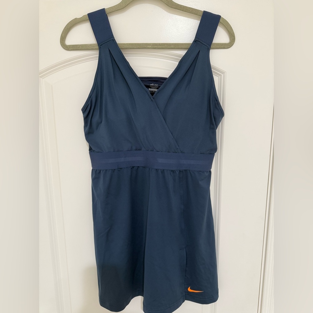 Nike Dri-FIT Serena Dress with orange swoosh
